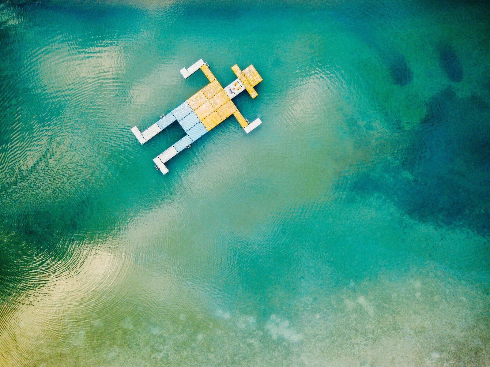 wooden toy floating on body of water